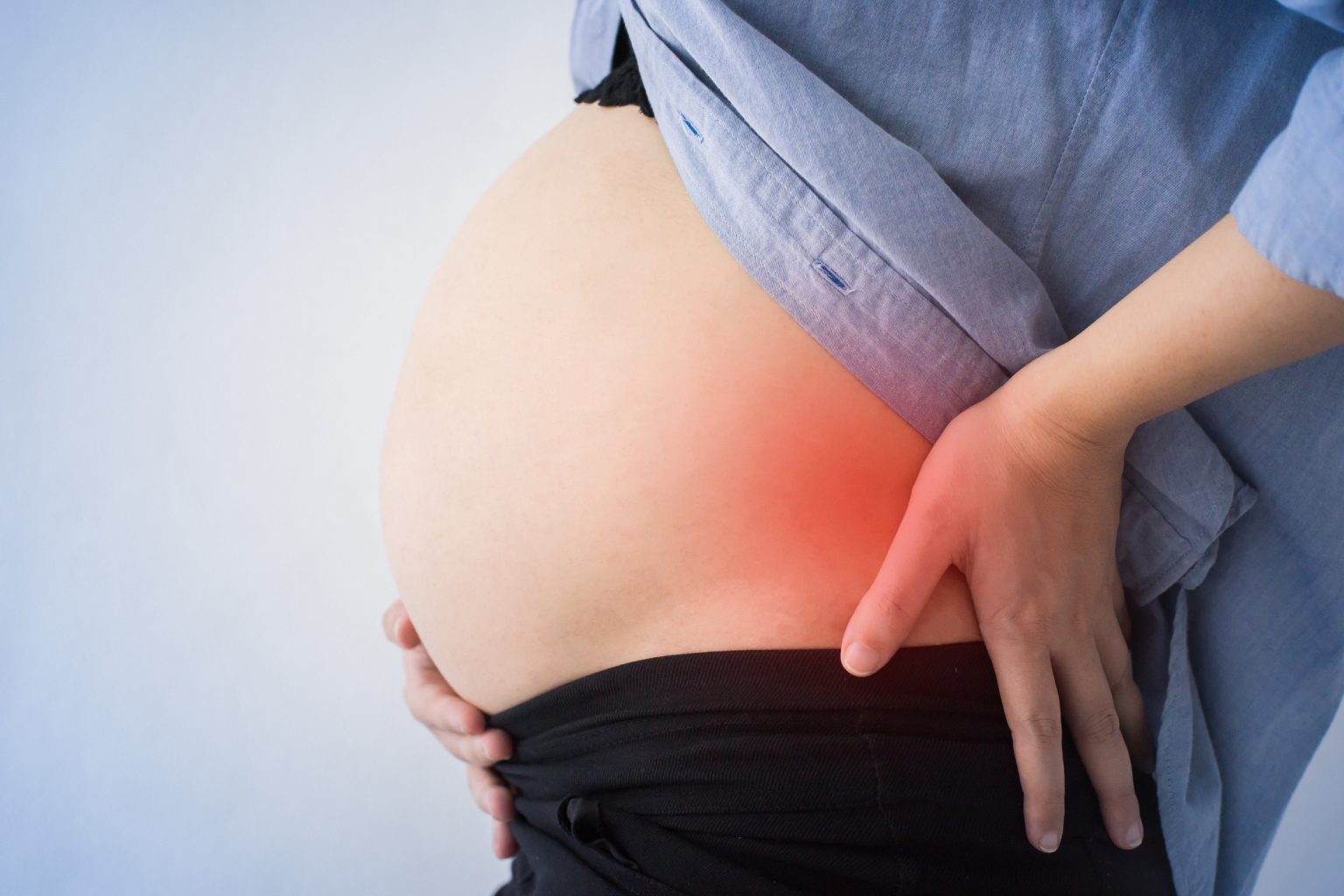 Ноет поясница при беременности. Беременные со спины. Многоплодовая беременность женщин.